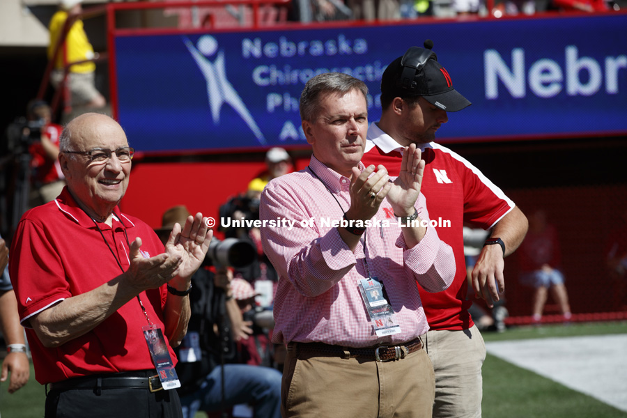 Former United States Agriculture Secretery Clayton Yeutter, left, and University of Nebraska Chancellor Ronnie Green celebrate a Husker play at the end of the first quarter. Nebraska vs. Wyoming football. September 10, 2016. Photo by Craig Chandler / University Communication Photography.